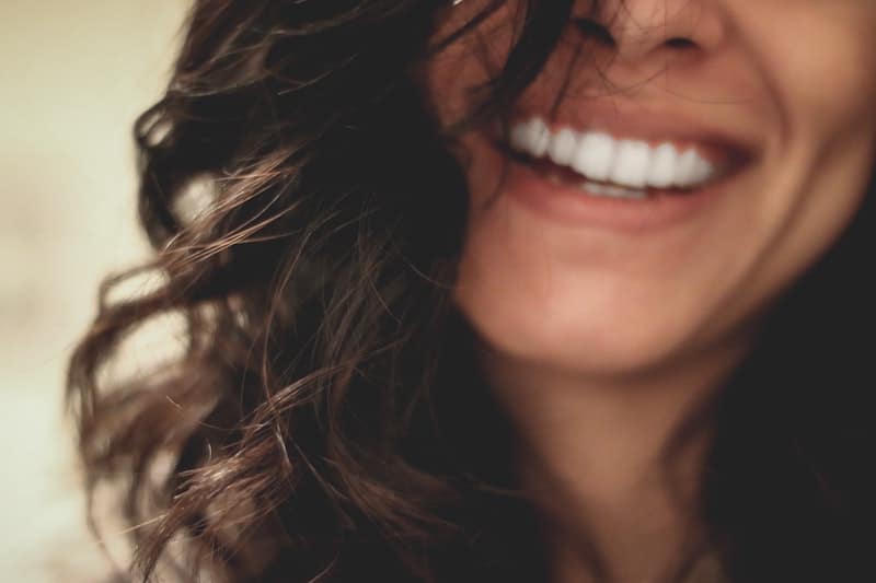 a photo of a woman's mouth smiling 