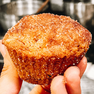 hand holding a apple muffin